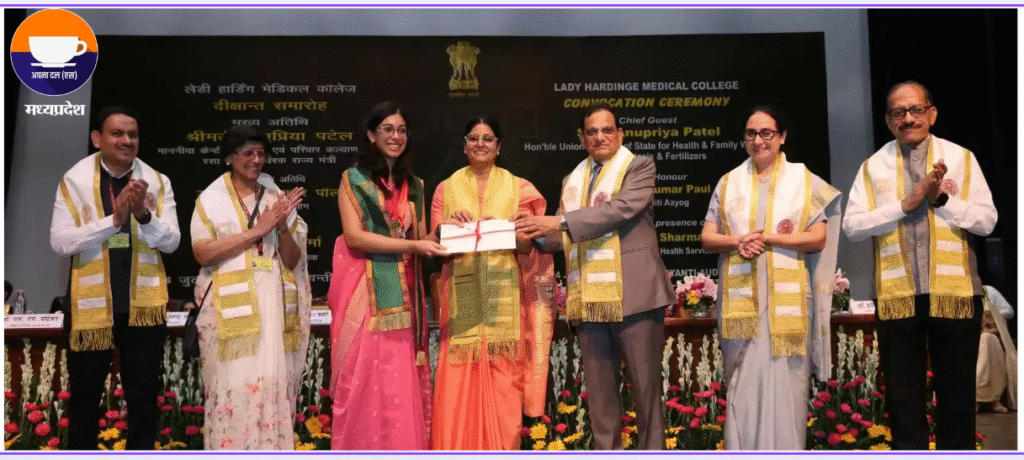 Smt. Anupriya Patel, Union Minister, handing a degree to a student at the Lady Hardinge Medical College convocation, with Dr. Vinod Kumar Paul and Dr. Sunita Sharma present, surrounded by faculty and decorated stage.
